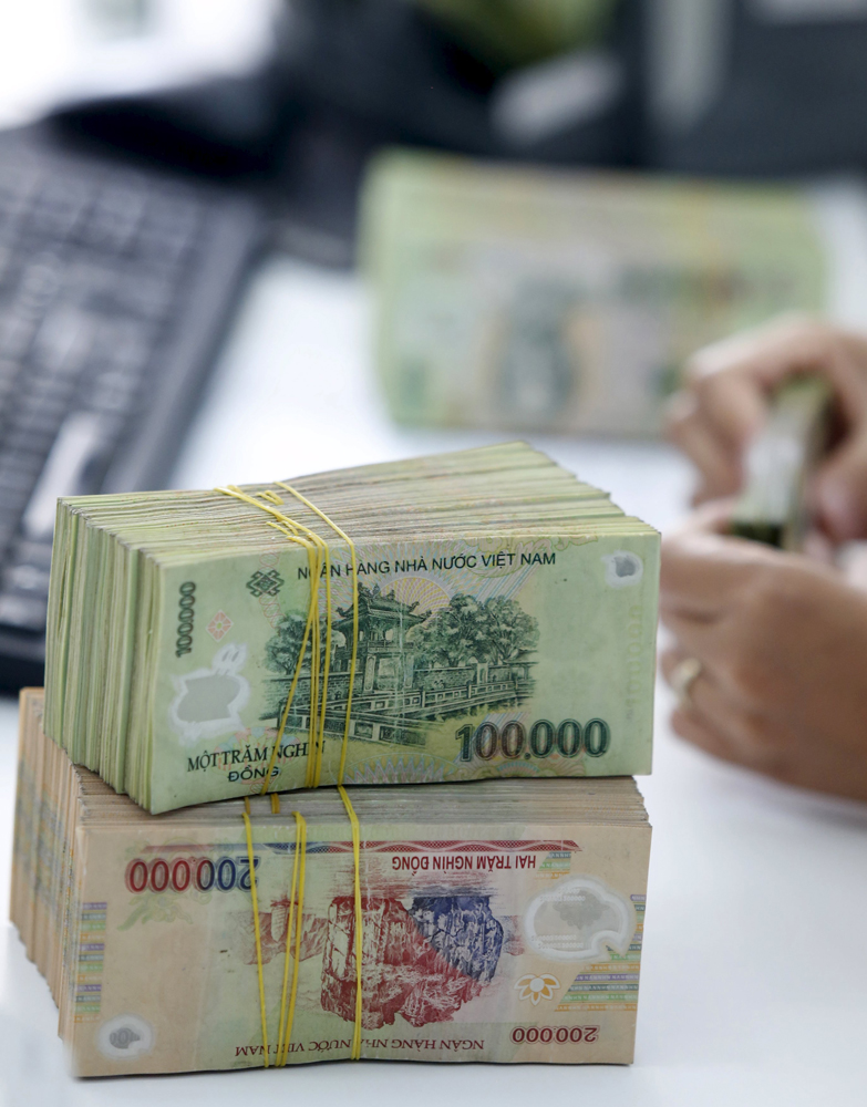 图:越南央行调低越南盾兑美元参考汇率